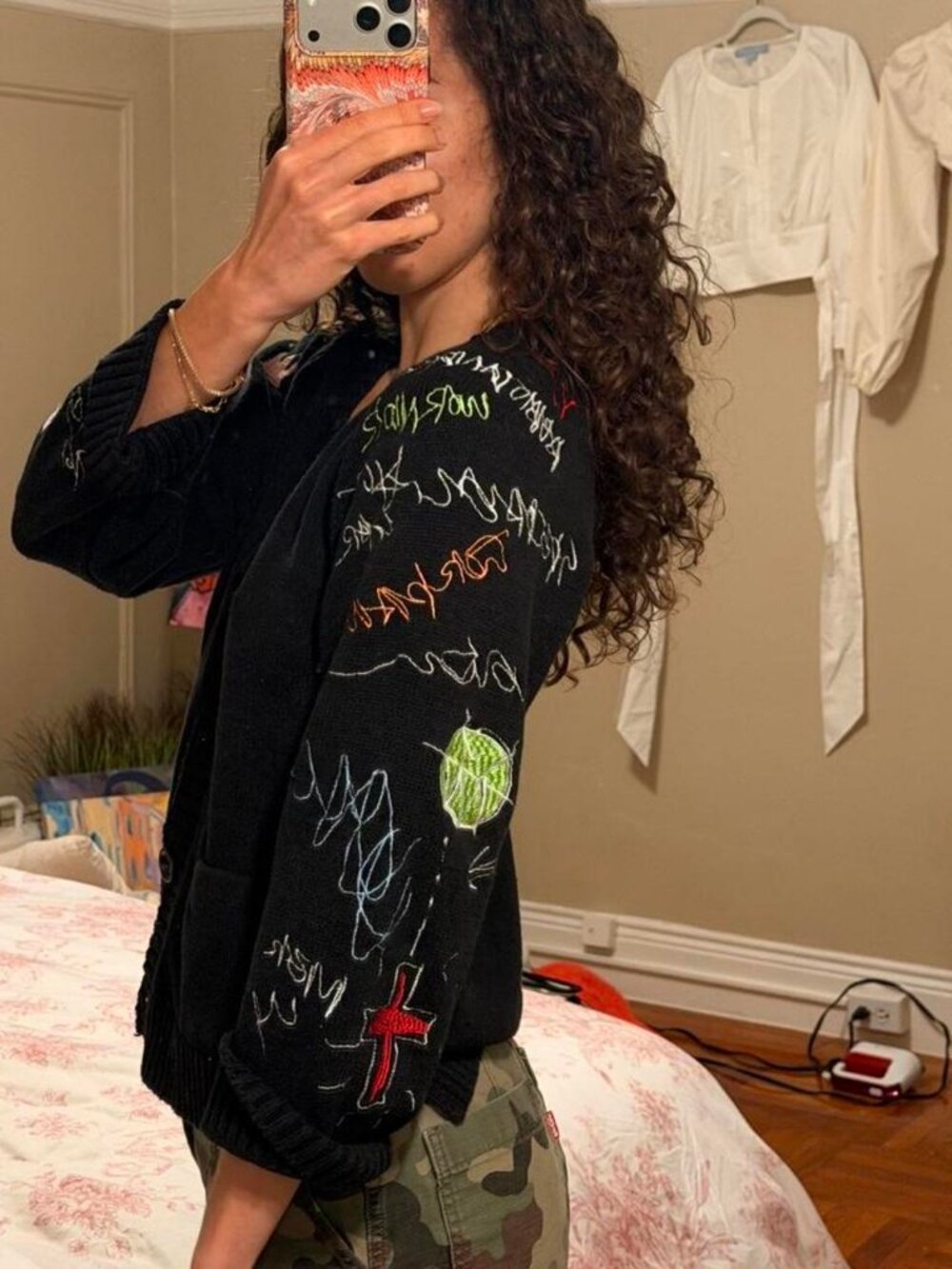 Black vintage cardigan with multicolored graffiti-style writing and drawings